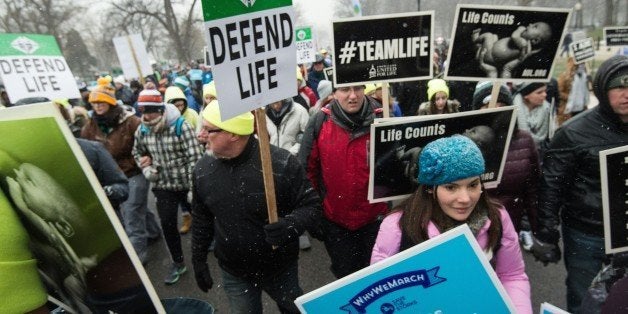 Anti-abortion demonstrators march to the US Supreme Court in Washington, DC, 0n January 22, 2016 as the country marks the 43rd anniversary of the Roe v Wade Supreme Court decision which legalized abortion. / AFP / Nicholas Kamm (Photo credit should read NICHOLAS KAMM/AFP/Getty Images)