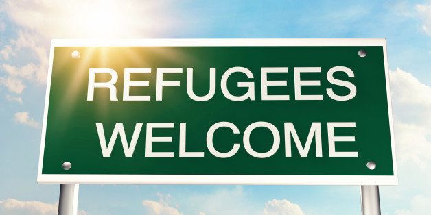 Refugees welcome as a road sign
