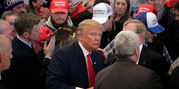 PELLA, IA - JANUARY 23: Republican presidential candidate Donald Trump greets guests during a campaign event January 23, 2016 in Pella, Iowa. Trump, who is seeking the nomination from the Republican Party is on the presidential campaign trail across Iowa ahead of the Iowa Caucus taking place February 1. (Photo by Joshua Lott/Getty Images)