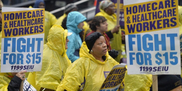 NEW YORK CITY, Nov. 10, 2015-- People attend the strike in support of a $15-per-hour minimum wage in New York City, the United States, Nov. 10, 2015. Hundreds of fast food workers took part in strike nationwide Tuesday, joining other workers in pressing for a more livable wage. (Xinhua/Wang Lei via Getty Images)