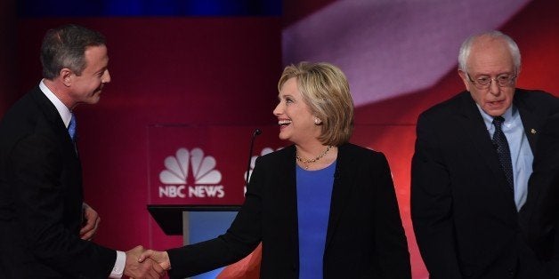 Democratic presidential candidates Martin O'Malley (L), Hillary Clinton (C) and Bernie Sanders (R) greet one another following the NBC News -YouTube Democratic Candidates Debate on January 17, 2016 at the Gaillard Center in Charleston, South Carolina. / AFP / TIMOTHY A. CLARY (Photo credit should read TIMOTHY A. CLARY/AFP/Getty Images)