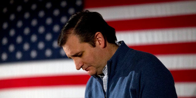 Republican presidential candidate, Sen. Ted Cruz, R-Texas, looks downward while listening to a question from the crowd at a c