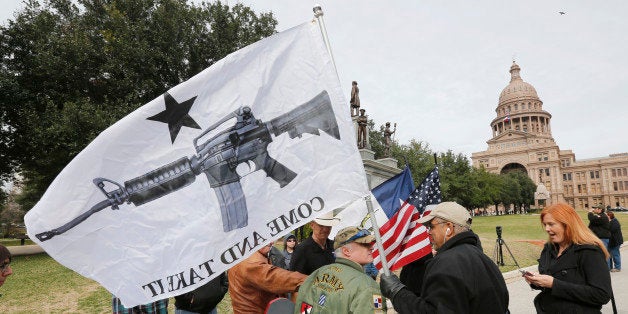 AUSTIN, TX - JANUARY 1: On January 1, 2016, the open carry law took effect in Texas, and 2nd Amendment activists held an open carry rally at the Texas state capitol on January 1, 2016 in Austin, Texas. Armando Valledares of Killeen holds the 'Come And Take It' flag. (Photo by Erich Schlegel/Getty Images)