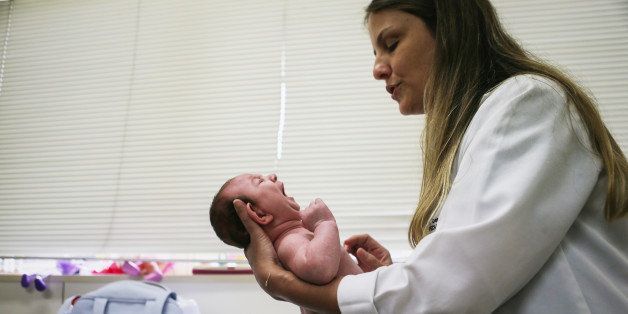 RECIFE, BRAZIL - JANUARY 27: Dr. Vanessa Van Der Linden, the neuro-pediatrician who first recognized the microcephaly crisis in Brazil, examines a 2-month-old baby with microcephaly on January 27, 2016 in Recife, Brazil. The baby's mother was diagnosed with having the Zika virus during her pregnancy. In the last four months, authorities have recorded close to 4,000 cases in Brazil in which the mosquito-borne Zika virus may have led to microcephaly in infants. The ailment results in an abnormally small head in newborns and is associated with various disorders including decreased brain development. According to the World Health Organization (WHO), the Zika virus outbreak is likely to spread throughout nearly all the Americas. At least twelve cases in the United States have now been confirmed by the CDC. (Photo by Mario Tama/Getty Images)