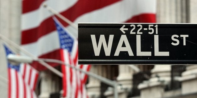 The Wall Street sign near the front of the New York Stock Exchange August 5, 2011. AFP PHOTO/Stan HONDA (Photo credit should read STAN HONDA/AFP/Getty Images)