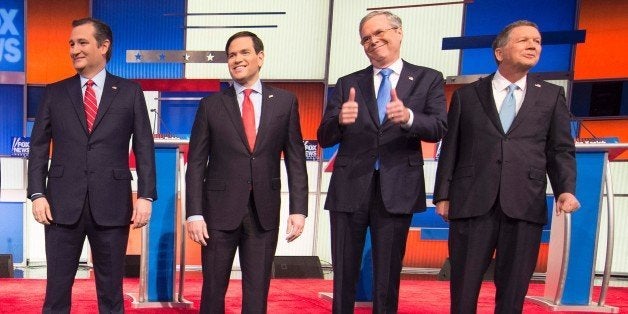 Republican Presidential candidates (L-R) Texas Senator Ted Cruz, Florida Senator Marco Rubio, former Florida Gov. Jeb Bush, and Ohio Gov. John Kasich arrive for the Republican Presidential debate sponsored by Fox News at the Iowa Events Center in Des Moines, Iowa on January 28, 2016. / AFP / AFP PHOTO / Jim WATSON (Photo credit should read JIM WATSON/AFP/Getty Images)