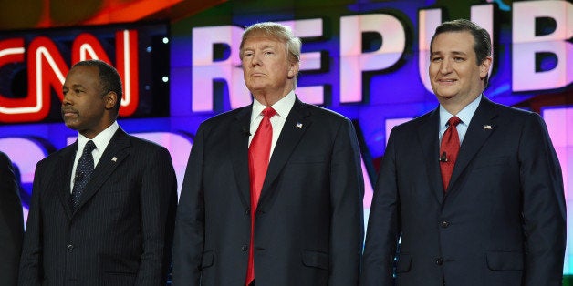 LAS VEGAS, NV - DECEMBER 15: Republican presidential candidates (L-R) Ben Carson, Donald Trump and Sen. Ted Cruz stand on st