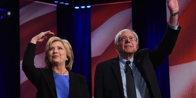 Democratic presidential candidate, former Secretary of State Hillary Clinton (L) and Vermont Senator Bernie Sanders (R) arrive on stage for the NBC News -YouTube Democratic Candidates Debate on January 17, 2016 at the Gaillard Center in Charleston, South Carolina. / AFP / TIMOTHY A. CLARY (Photo credit should read TIMOTHY A. CLARY/AFP/Getty Images)