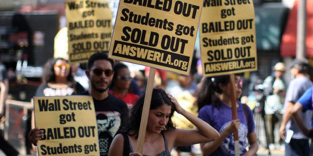LOS ANGELES, CA - SEPTEMBER 22: Students protest the rising costs of student loans for higher education on Hollywood Boulevard on September 22, 2012 in the Hollywood section of Los Angeles, California. Citing bank bailouts, the protesters called for student debt cancelations. (Photo by David McNew/Getty Images)
