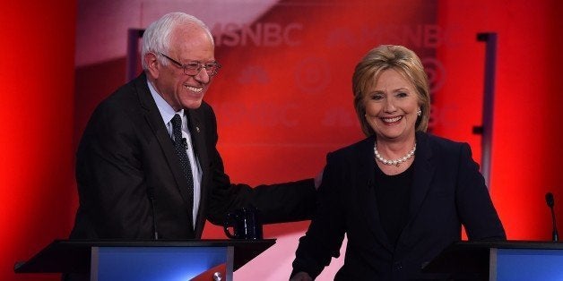 US Democratic presidential candidates Hillary Clinton (R) and Bernie Sanders smile after participating in the MSNBC Democratic Candidates Debate at the University of New Hampshire in Durham on February 4, 2016. Clinton and Sanders face off on February 4, in the first debate since their bruising Iowa clash that the former secretary of state won by a hair, as they gear for a battle royale in New Hampshire. / AFP / Jewel Samad (Photo credit should read JEWEL SAMAD/AFP/Getty Images)