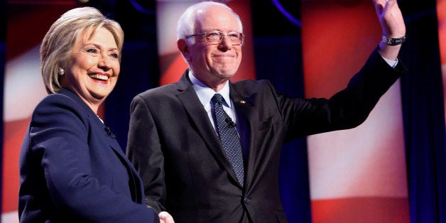Democratic presidential candidates Hillary Clinton, left, and Sen. Bernie Sanders, I-Vt, pose for a photo before debating at