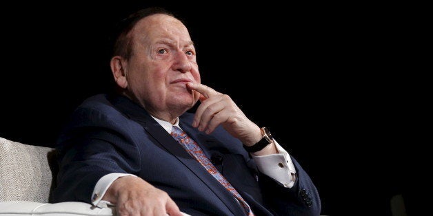 Gambling giant Las Vegas Sands Corp's Chief Executive Sheldon Adelson reacts during a news conference in Macau, China Decembe