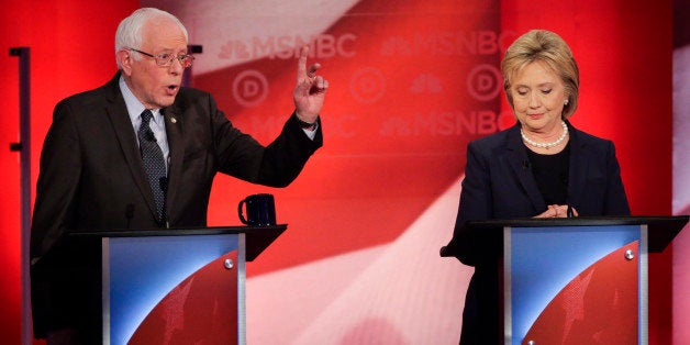 Democratic presidential candidate, Sen. Bernie Sanders, I-Vt, makes a point as Democratic presidential candidate, Hillary Clinton listens during a Democratic presidential primary debate hosted by MSNBC at the University of New Hampshire Thursday, Feb. 4, 2016, in Durham, N.H. (AP Photo/David Goldman)