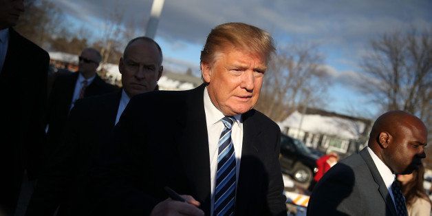 MANCHESTER, NH - FEBRUARY 09: Republican presidential candidate Donald Trump greets people as he visits a polling station as voters cast their primary day ballots on February 9, 2016 in Manchester, New Hampshire. The process to select the next Democratic and Republican Presidential candidates continues. (Photo by Joe Raedle/Getty Images)