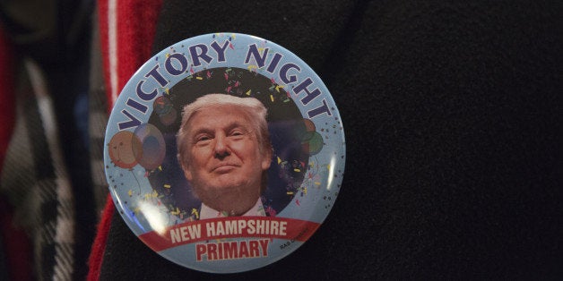 An attendee wears a victory campaign button for Donald Trump, president and chief executive of Trump Organization Inc. and 2016 Republican presidential candidate, during a primary watch party in Manchester, New Hampshire, U.S., on Tuesday, Feb. 9, 2016. Trump re-assumed his front-runner status in the Republican nominating contest after finishing second in the Iowa caucuses on Feb. 1 to Texas Senator Ted Cruz, despite leading state and national polls for months. Photographer: Victor J. Blue/Bloomberg via Getty Images