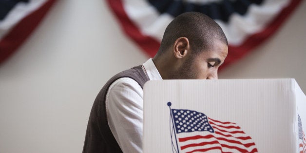 Hispanic voter voting in polling place