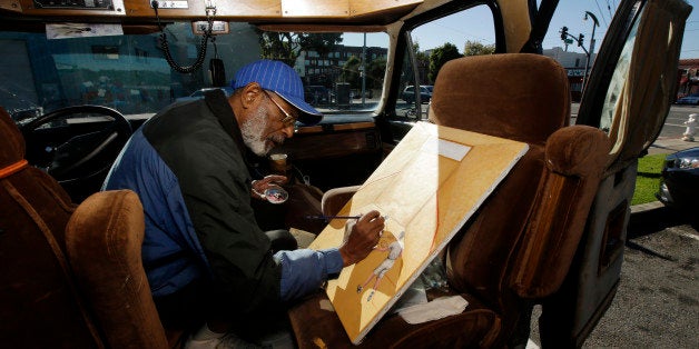 In this Nov. 10, 2015, photo, Ira Watkins, a homeless artist, works on a painting inside of the van where he works and lives in the Bayview-Hunters Point district in San Francisco. As San Francisco rides a massive building boom reminiscent of post-World War II, fueled largely by growth in tech-based jobs, developers are finally wading into a part of the city long plagued by too much poverty and not enough fresh produce markets. (AP Photo/Marcio Jose Sanchez)