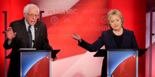 Democratic presidential candidate, Sen. Bernie Sanders, I-Vt, and Democratic presidential candidate, former Secretary of State Hillary Clinton spar during a Democratic presidential primary debate hosted by MSNBC at the University of New Hampshire Thursday, Feb. 4, 2016, in Durham, N.H. (AP Photo/David Goldman)