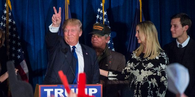 MANCHESTER, NH - FEBRUARY 9: Republican presidential candidate Donald Trump, surrounded by family and friends, gives the peace sign as he celebrates his victory at a New Hampshire primary campaign watch party at the Executive Court Banquet Facility in Manchester, NH on Tuesday Feb. 09, 2016. (Photo by Jabin Botsford/The Washington Post via Getty Images)