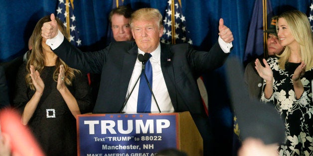 Republican presidential candidate, businessman Donald Trump gives thumbs up to supporters during a primary night rally, Tuesday, Feb. 9, 2016, in Manchester, N.H. (AP Photo/David Goldman)