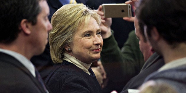 Hillary Clinton, former Secretary of State and 2016 Democratic presidential candidate, center, greets attendees during a primary night event in Manchester, New Hampshire, U.S., on Monday, Feb. 8, 2016. Clinton congratulated Senator Bernie Sanders, an independent from Vermont and 2016 Democratic presidential candidate, on his victory in her concession speech in Hooksett and vowed to battle on, saying she knows how to get results voters are demanding. Photographer: Daniel Acker/Bloomberg via Getty Images 