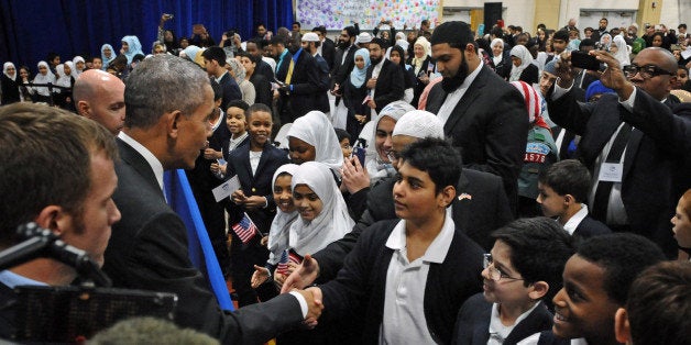 President Barack Obama shakes hand with students of the Al-Rahmah School during his visit to the Islamic Society of Baltimore