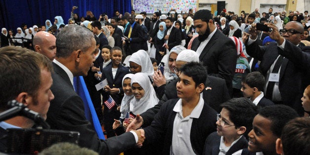 President Barack Obama shakes hand with students of the Al-Rahmah School during his visit to the Islamic Society of Baltimore on Wednesday, Feb. 3, 2016. (Kenneth K. Lam/Baltimore Sun/TNS via Getty Images)