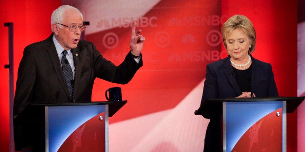 Democratic presidential candidate, Sen. Bernie Sanders, I-Vt, makes a point as Democratic presidential candidate, Hillary Clinton listens during a Democratic presidential primary debate hosted by MSNBC at the University of New Hampshire Thursday, Feb. 4, 2016, in Durham, N.H. (AP Photo/David Goldman)