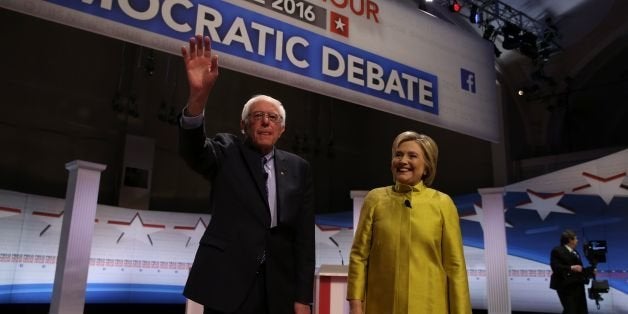 US Democratic presidential candidates Hillary Clinton and Bernie Sanders greet the audience before the PBS NewsHour President