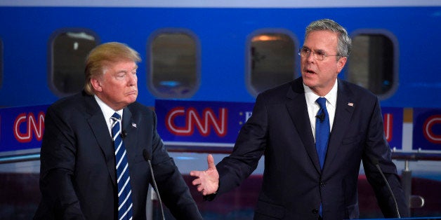 Republican presidential candidate Donald Trump, left, listens as former Florida Gov. Jeb Bush speaks during the CNN Republican presidential debate at the Ronald Reagan Presidential Library and Museum, Wednesday, Sept. 16, 2015, in Simi Valley, Calif. (AP Photo/Mark J. Terrill)