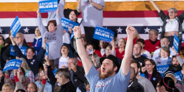 A supporter cheers after Democratic presidential candidate Sen. Bernie Sanders, I-Vt., is announced the winner of the New Hampshire primary during a watch party at Concord High School, Tuesday, Feb. 9, 2016, in Concord, N.H. (AP Photo/John Minchillo)