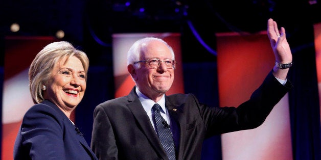 Democratic presidential candidates Hillary Clinton, left, and Sen. Bernie Sanders, I-Vt, pose for a photo before debating at