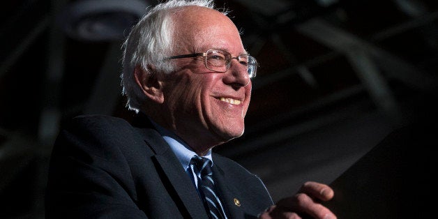 Democratic presidential candidate Sen. Bernie Sanders, I-Vt., smiles before he speaks during a primary night watch party at Concord High School, Tuesday, Feb. 9, 2016, in Concord, N.H. (AP Photo/John Minchillo)