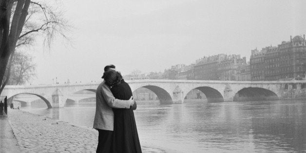 a courting couple on the bank of the Seine, Paris, 1954. (Photo by Fred Van Schagen/BIPs/Hulton Archive/Getty Images)