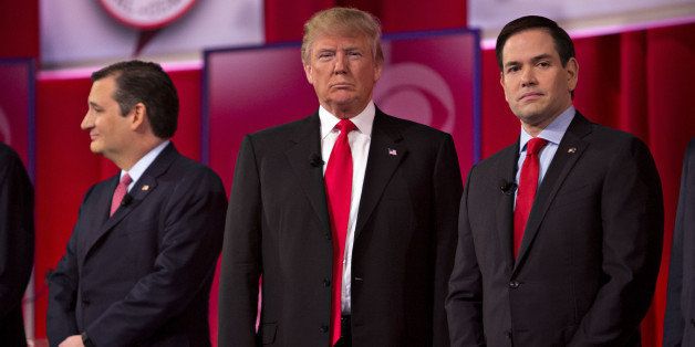 2016 Republican Presidential candidates Senator Ted Cruz, a Republican from Texas, from left, Donald Trump, president and chief executive of Trump Organization Inc., and Senator Marco Rubio, a Republican from Florida, stand on stage at the start of the Republican presidential candidate debate sponsored by CBS News and the Republican National Committee at the Peace Center in Greenville, South Carolina, U.S., on Saturday, Feb. 13, 2016. Donald Trump tops the GOP field with support from 36.3 percent of likely South Carolina Republican primary voters with Ted Cruz at 19.6 percent, according to a poll conducted for the Augusta Chronicle released on Friday. Photographer: Daniel Acker/Bloomberg via Getty Images 