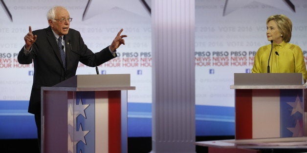 Democratic presidential candidate, Sen. Bernie Sanders, I-Vt, speaks as Hillary Clinton listens during a Democratic presidential primary debate at the University of Wisconsin-Milwaukee, Thursday, Feb. 11, 2016, in Milwaukee. (AP Photo/Morry Gash)