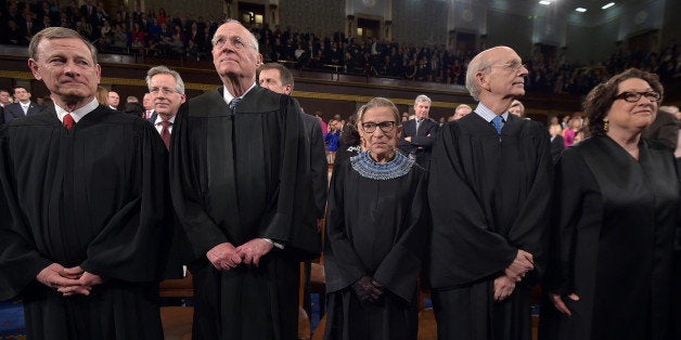 From left, Chief Justice John G. Roberts and Supreme Court justices Anthony M. Kennedy, Ruth Bader Ginsburg, Stephen G. Breyer and Sonia Sotomayor stand before President Barack Obama's State Of The Union address on Tuesday, Jan. 20, 2015, on Capitol Hill in Washington. (AP Photo/Mandel Ngan, Pool)