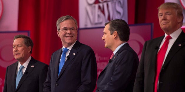 Republican presidential candidates John Kasich (L) and Donald Trump (R) look on as Jeb Bush (2nd-L) confers with Ted Cruz (2nd-R) during the CBS News Republican Presidential Debate in Greenville, South Carolina, February 13, 2016. / AFP / JIM WATSON (Photo credit should read JIM WATSON/AFP/Getty Images)