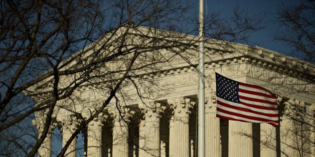 The American flag flies at half-staff in front of the U.S. Supreme Court building in Washington, D.C., U.S., on Tuesday, Feb. 16, 2016 Justice Antonin Scalia's unexpected death, and Senate Republicans' refusal to confirm a successor while President Barack Obama is in office, threatens to ignite a year-long battle over the court's future. Photographer: Andrew Harrer/Bloomberg via Getty Images