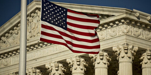 The American flag flies at half-staff in front of the U.S. Supreme Court building in Washington, D.C., U.S., on Tuesday, Feb. 16, 2016 Justice Antonin Scalia's unexpected death, and Senate Republicans' refusal to confirm a successor while President Barack Obama is in office, threatens to ignite a year-long battle over the court's future. Photographer: Andrew Harrer/Bloomberg via Getty Images