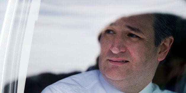 Republican presidential candidate Sen. Ted Cruz, R-Texas, speaks with his aide from a vehicle Sunday, Feb. 14, 2016, after at