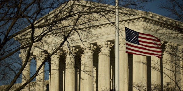 The American flag flies at half-staff in front of the U.S. Supreme Court building in Washington, D.C., U.S., on Tuesday, Feb.