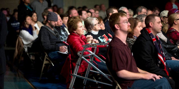 Members of the audience listen as Republican presidential candidate Donald Trump speaks at a rally at Sumter Country Civic Center in Sumter, S.C., Wednesday, Feb. 17, 2016. (AP Photo/Andrew Harnik)