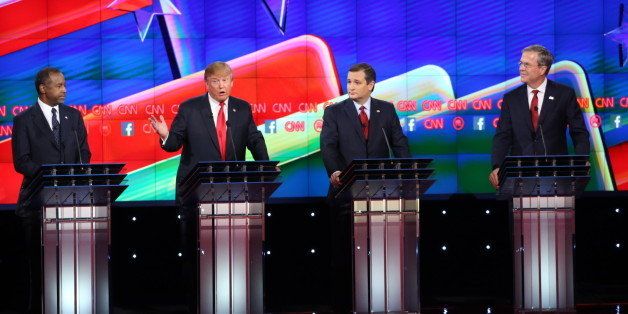 Donald Trump, president and chief executive of Trump Organization Inc. and 2016 Republican presidential candidate, second left, speaks as 2016 Republican presidential candidates Ben Carson, retired neurosurgeon, from left, Senator Ted Cruz, a Republican from Texas, and Jeb Bush, former governor of Florida and 2016 Republican presidential candidate, listen during the Republican presidential candidate debate at The Venetian in Las Vegas, Nevada, U.S., on Tuesday, Dec. 15, 2015. With less than two months remaining before the Feb. 1 Iowa caucuses and the Feb. 9 New Hampshire primary, middle-of-the-pack candidates hoping for a late surge in the polls have little choice but to come out swinging in tonight's fifth Republican debate. Photographer: Ruth Fremson/Pool via Bloomberg 