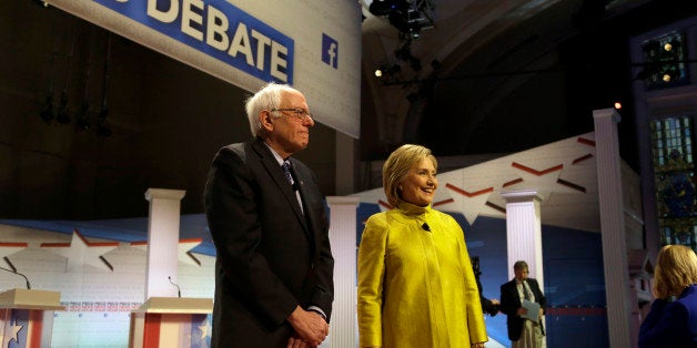 Democratic presidential candidates Sen. Bernie Sanders, I-Vt, left, and Hillary Clinton take the stage before a Democratic pr