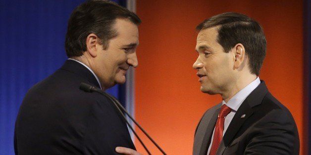 Ted Cruz and Marco Rubio talk after a Republican presidential primary debate, Thursday, Jan. 28, 2016, in Des Moines, Iowa. (AP Photo/Chris Carlson)