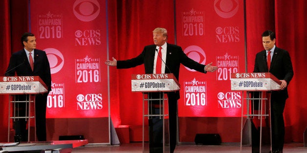 Republican presidential candidate, businessman Donald Trump speaks about Republican presidential candidate, Sen. Ted Cruz, R-Texas, left, as Republican presidential candidate, Sen. Marco Rubio, R-Fla., right, during the CBS News Republican presidential debate at the Peace Center, Saturday, Feb. 13, 2016, in Greenville, S.C. (AP Photo/John Bazemore)