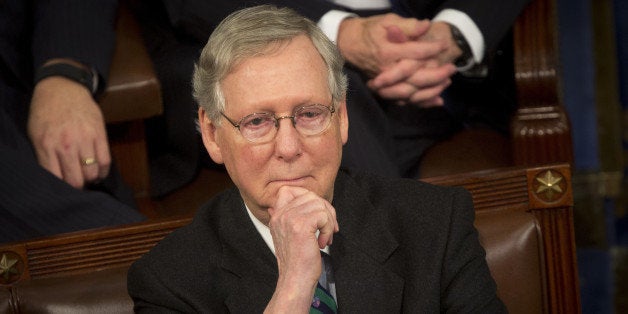 Senate Majority Leader Mitch McConnell, a Republican from Kentucky, listens to U.S. President Barack Obama deliver the State