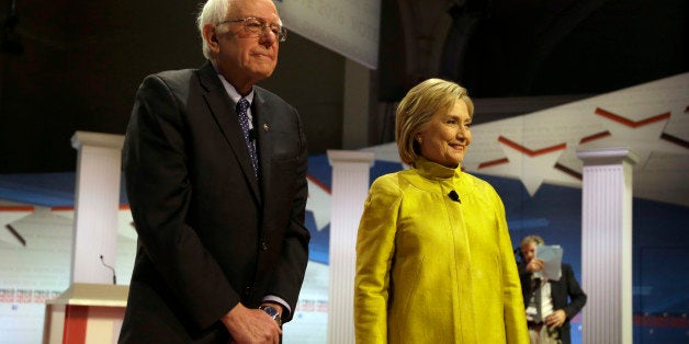 Democratic presidential candidates Sen. Bernie Sanders, I-Vt, left, and Hillary Clinton take the stage before a Democratic presidential primary debate at the University of Wisconsin-Milwaukee, Thursday, Feb. 11, 2016, in Milwaukee. (AP Photo/Tom Lynn)