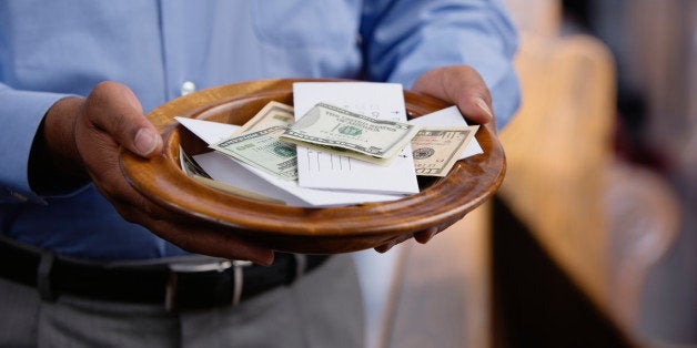 Man holding offering plate